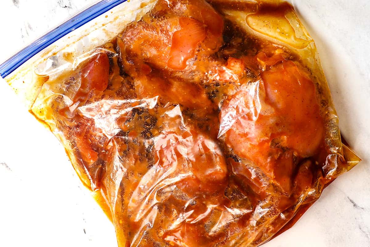 showing how to make Huli Huli Chicken by marinating the chicken in a bag