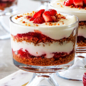 You won't believe how easy these NO BAKE Strawberry Cheesecake Parfaits are - and they taste are even more delicious than they look!  All the fresh and creamy taste of strawberry cheesecake without all the hassle!  