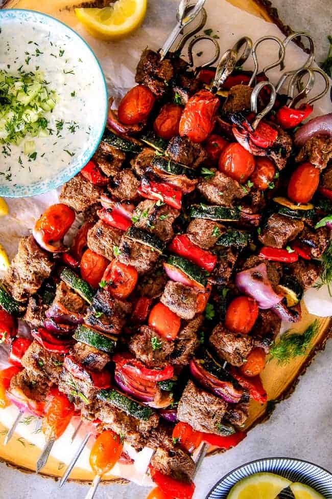 These easy Baked or Grilled Greek Beef Kabobs are so crazy juicy and exploding with flavor in every mouthwatering bite!  And the creamy, refreshing Whipped Feta Whipped Feta Tzatziki Dip is out of this world!  