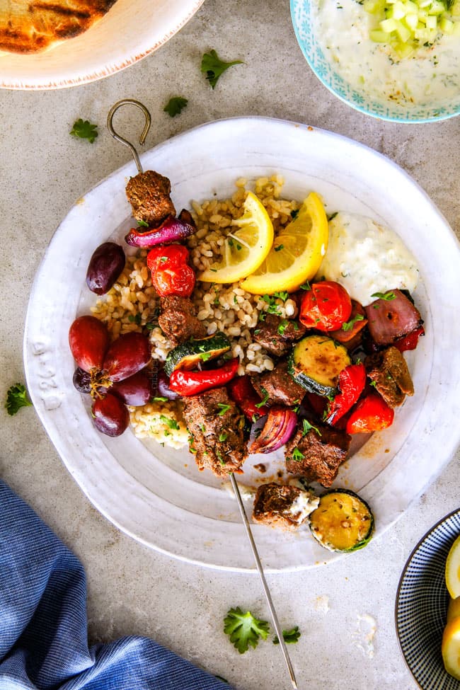 These easy Baked or Grilled Greek Beef Kabobs are so crazy juicy and exploding with flavor in every mouthwatering bite!  And the creamy, refreshing Whipped Feta Whipped Feta Tzatziki Dip is out of this world!  