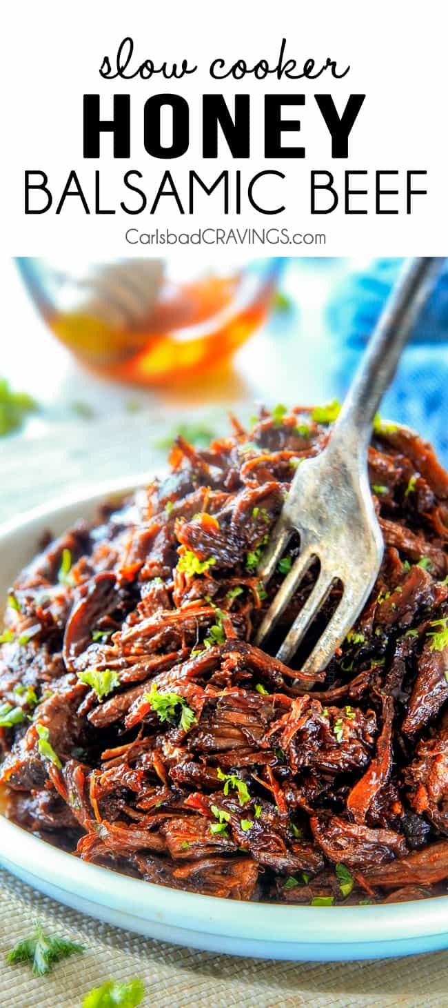 a fork sticking into wonderfully moist slow cooker roast beef