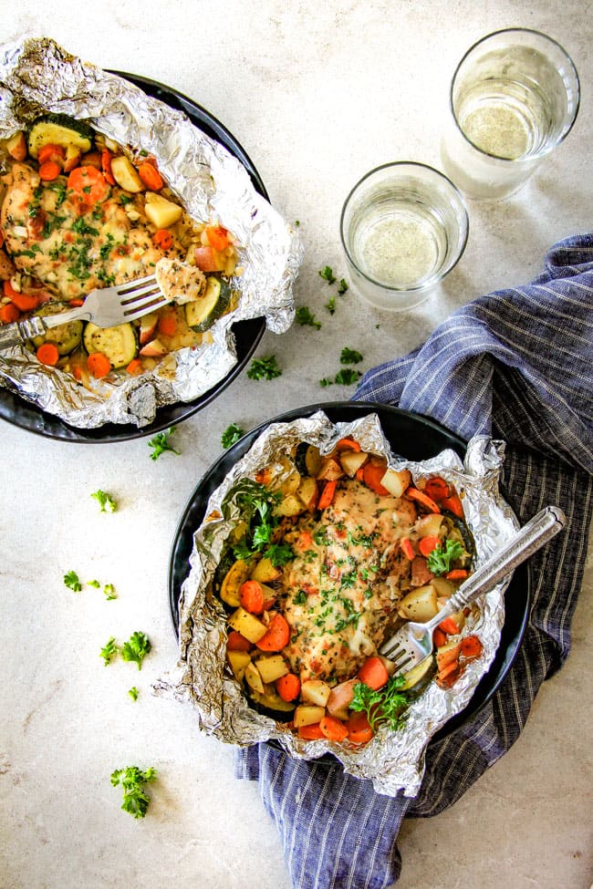 Baked or Grilled Italian Mozzarella Chicken Foil Packets are bursting with astonishingly juicy, flavorful chicken and tender, seasoned Potatoes, Carrots and Zucchini all smothered with Mozzarella Cheese!  These foil packets are meal-in-one that are quick to throw together and even quicker to clean up! 