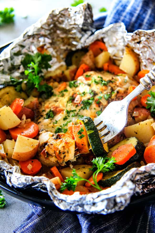 Baked or Grilled Italian Mozzarella Chicken Foil Packets are bursting with astonishingly juicy, flavorful chicken and tender, seasoned Potatoes, Carrots and Zucchini all smothered with Mozzarella Cheese!  These foil packets are meal-in-one that are quick to throw together and even quicker to clean up! 