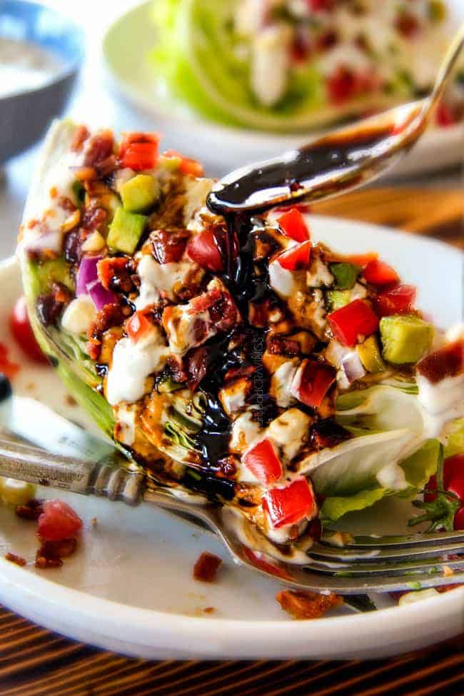 showing how to eat wedge salad by smothering it with dressing