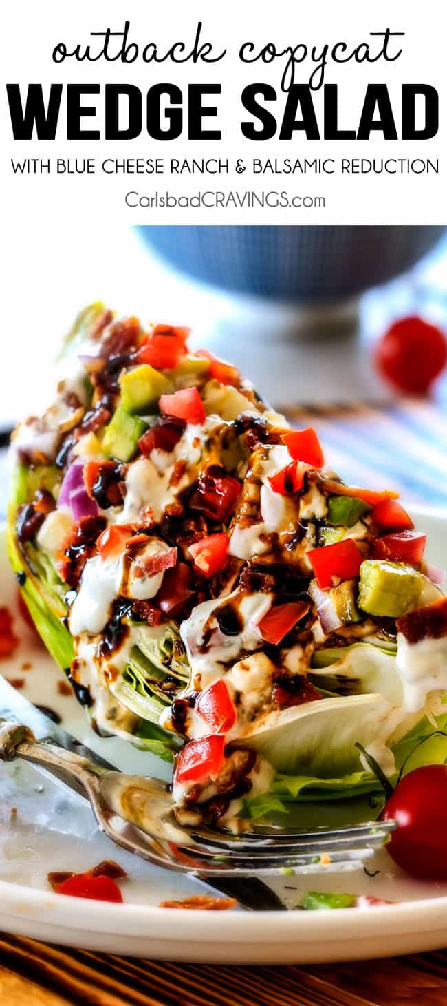 up close of wedge salad topped with homemade blue cheese dressing, bacon, red onion and tomatoes