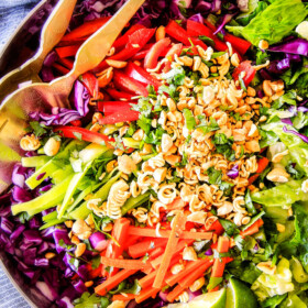 This Crunchy Asian Salad with Sriracha peanut Dressing is CRAZY GOOD!   The combination of texures is amazing and the dressing is absolutely addicting!  This salad is so good I was actually eating leftovers for breakfast! 
