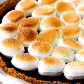 Make ahead Almost No Bake Nutella S'mores Pie is decadantly rich and creamy topped with golden marshmallows and SO EASY!  I made this for a dinner party and everyone wanted the recipe! 