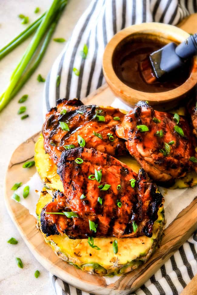 Mesquite Pineapple BBQ Chicken on a wood cutting board. 