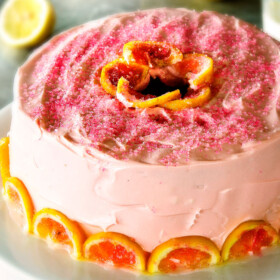 Moist, rich Pink Lemonade Cake smothered with tangy Lemon Buttercream frosting is wonderfully delicious and perfect for birthday parties or baby showers!