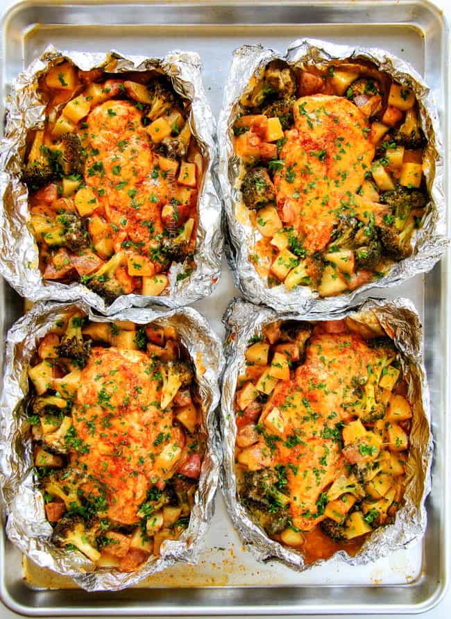 EASY Baked or Grilled Cheesy Buffalo Chicken Foil Packets bursting with juicy chicken and tender, flavorful veggies all smothered in cheddar and dipped in Ranch Crema!  these are SO addictingly delicious!!!   