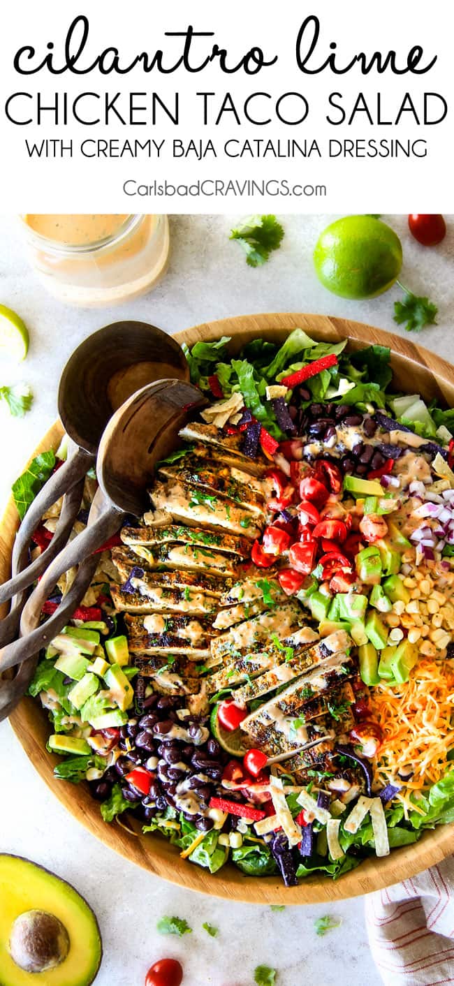 top view of chicken taco salad with black beans and corn in a wooden bowl