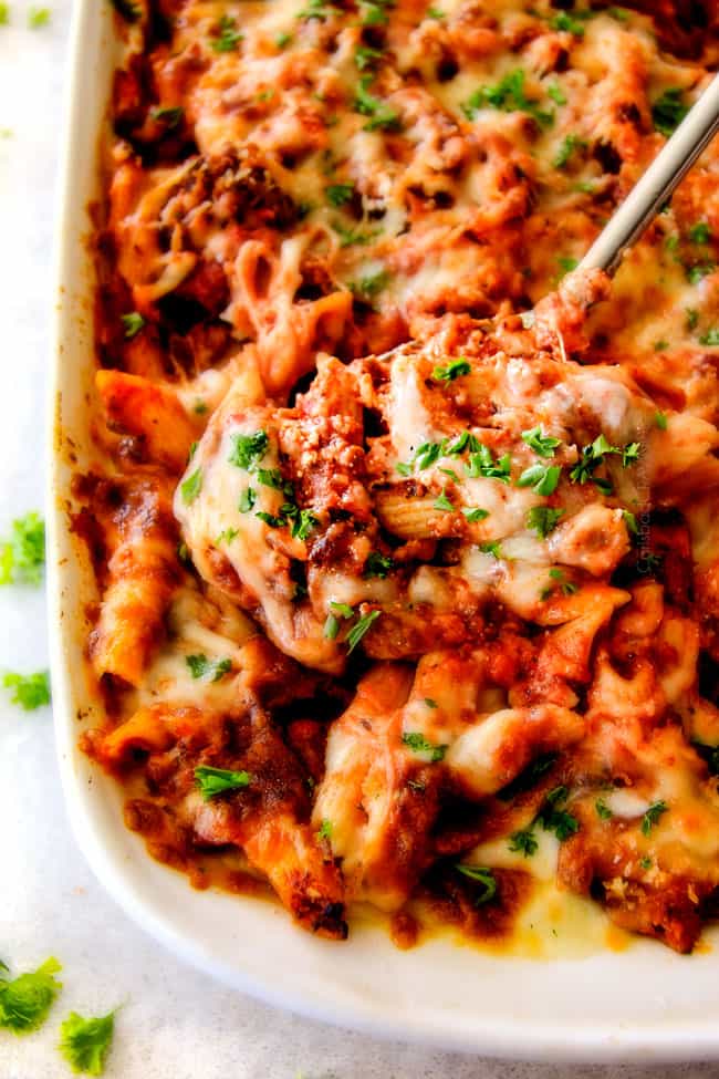 This Million Dollar Baked Penne has been a family favorite for decades!  We serve it at all our family gatherings because its SO good, so easy!  The homemade sauce is incredible and the hidden layer of creamy/cheesiness is to live for! 