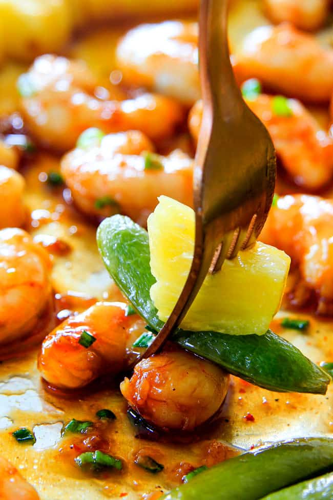 up close of a fork with teriyaki shrimp with the best homemade teriyaki sauce