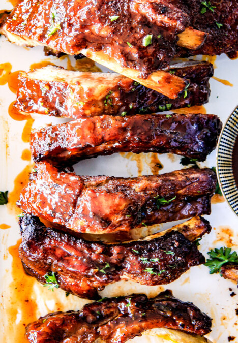 15 minute prep Fall-Off-the-Bone Slow Cooker HONEY BUFFALO Ribs that everyone goes crazy for!  These are SO tender and SO easy!  They are slathered in an amazing rub and the most addicting honey buffalo sauce ever!