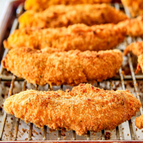 incredibly tender, juicy flavorful Baked Cheddar Ranch Chicken Tenders coated in the most AMAZING cheese cracker breading!  These are pure addicting and SO EASY! 