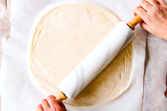 showing how to make pie  crust by rolling dough into a circle