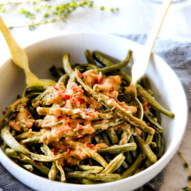 Forget green bean casserole, these wonderfully flavorful, crisp tender Roasted Green Beans with Creamy Gruyere Sauce are AMAZING!!!  They the best green beans you will ever eat!   They are easy enough for every day but delicious enough for special occasions (like Thanksgiving, Christmas!)! 