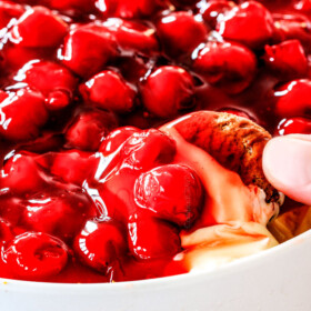 Easy, creamy NO BAKE Cherry Cheesecake Dip is one of the easiest AND most delicious desserts/appetizers that comes together in minutes! The perfect make ahead, stress free, crowd pleaser for all your holiday parties!