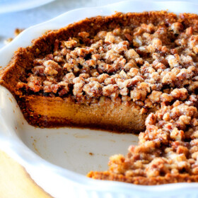 I will never go back to just Pumpkin Pie again!  This Pumpkin PRALINE Pie is a Thanksgiving and Christmas must!  Creamy pumpkin pie topped with crunchy, chewy brown sugar pecans for the perfect flavor and texture combination in every bite!  