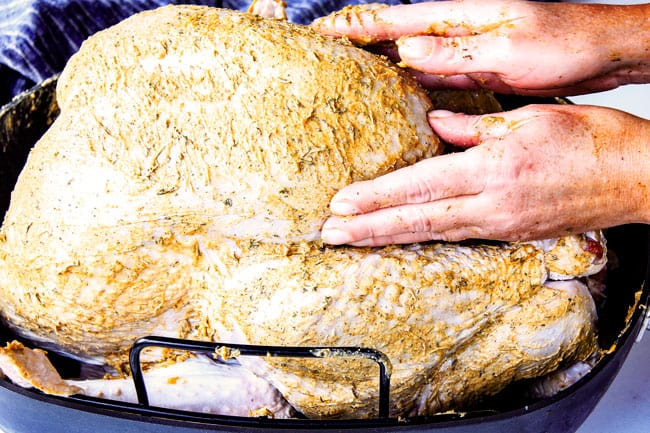 Seasoning Roast Turkey with Herb Butter.