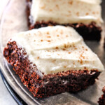 Soft and chewy Gingerbread Brownies are your favorite holiday cookie in rich chocolate brownie form all smothered in luscious Eggnog Cream Cheese Frosting!  These are destined to become a must make holiday favorite and so much easier than rolling/baking individual cookies! 