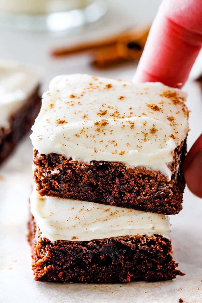 A stack of Gingerbread Brownies with Eggnog Frosting.