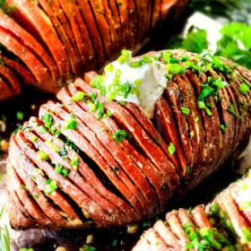 These Hasselback Sweet Potatoes are tender, melt-in-your-mouth and bursting with garlic herb, butter flavor!  They look wonderfully gourmet for holidays and special occasions but are everyday easy! 
