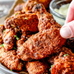 Crispy Ancho Baked Chicken Wings are tossed in the most tantalizing spice rub, baked until juicy on the inside, crispy on the outside then dunked in creamy Avocado Ranch!  These are so ADDICTING and you can prep them all in advance without the hassle, mess and heart attach of fried wings!   