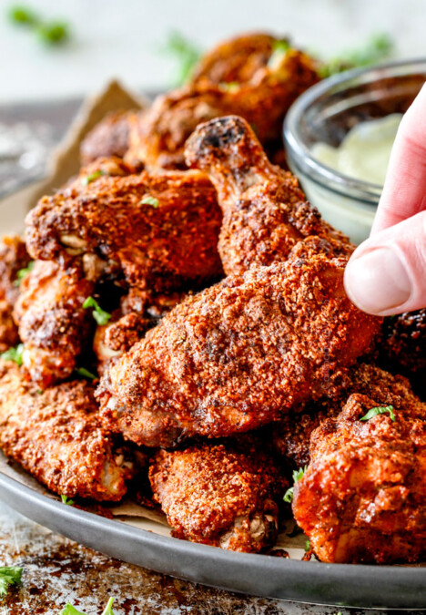 Crispy Ancho Baked Chicken Wings are tossed in the most tantalizing spice rub, baked until juicy on the inside, crispy on the outside then dunked in creamy Avocado Ranch!  These are so ADDICTING and you can prep them all in advance without the hassle, mess and heart attach of fried wings!   