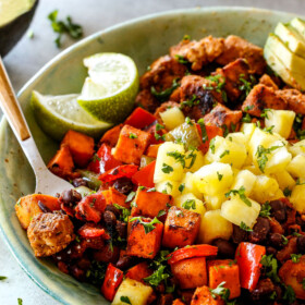 30 Minute Cajun Chicken Bowls bursting with avocados, black beans, sweet potatoes and pineapple!  These are spicy, fresh, healthy and ADDICTING!  
