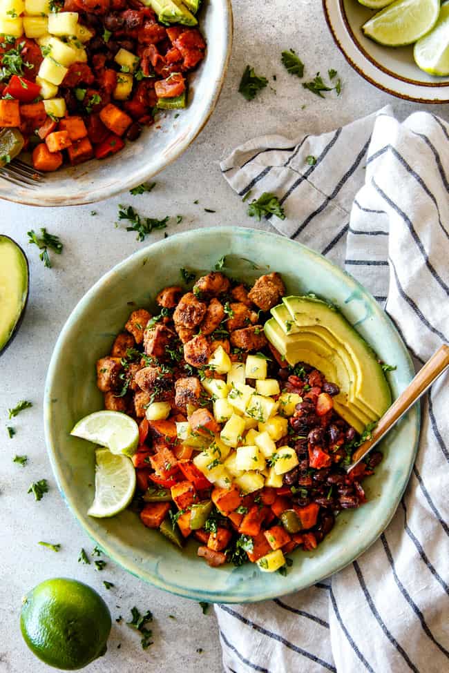 Top view of a bowl of Cajun Chicken Black Bean Bowls with Avocado, Sweet Potatoes & Pineapple.