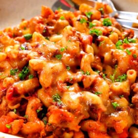up close of a bowl of chili mac and cheese showing how cheesy it is