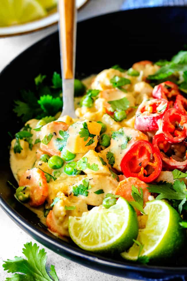 This EASY Thai Yellow Curry with Chicken tastes straight out of a restaurant!  Its wonderfully thick and creamy, bursting with flavor and veggies (I highly recommend the listed potatoes, cauliflower and peas) and all made in one pot! Definitely a hit at our house!