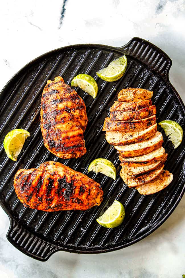 top view of showing  how to cook chili lime chicken  with three chicken breasts with grill marks on an indoor griill pan