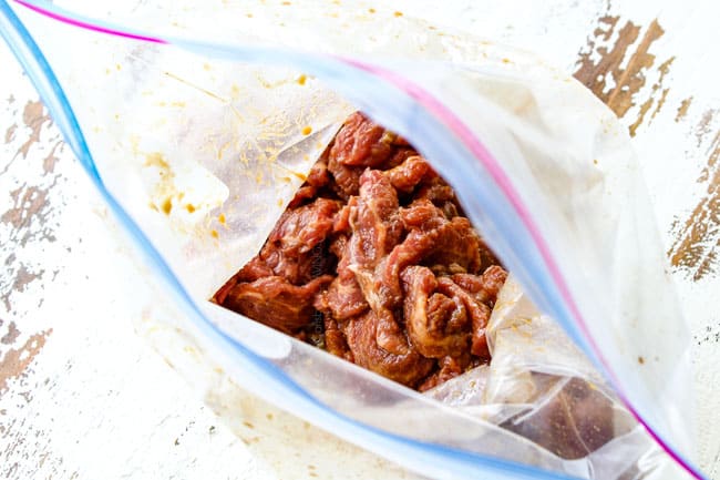 flank steak in a plastic bag with marinade showing how to make Beef and Broccoli
