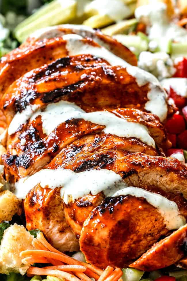 sliced buffalo chicken drizzled with blue cheese salad dressing 
