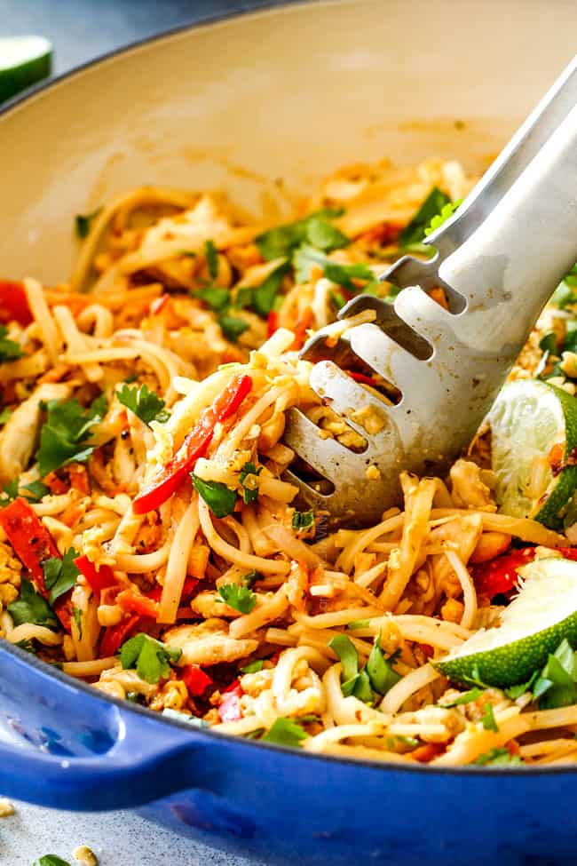 Close up view of Chicken Pad Thai in a blue pan. 