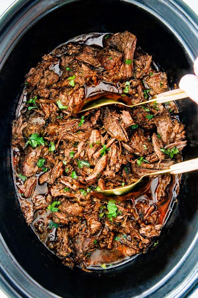 This is the BEST Slow Cooker Barbacoa Beef I have ever tried!  Super tender, juicy, EASY and bursting with rich, complex flavors!  Great for large crowds or make ahead meals and makes the best tacos, burritos, nachos, salads, etc!