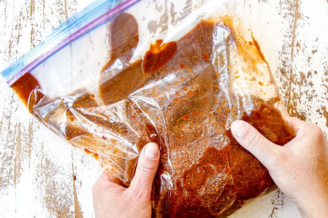 showing how to make grilled steak fajitas by adding steak to a freezer bag with marinade and spices