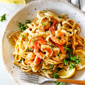 20 MINUTE Lemon Garlic Shrimp Fettuccine is wonderfully creamy, bursting with flavor and so easy!  The most gourmet tasting  dinner you can make in under 30 minutes!