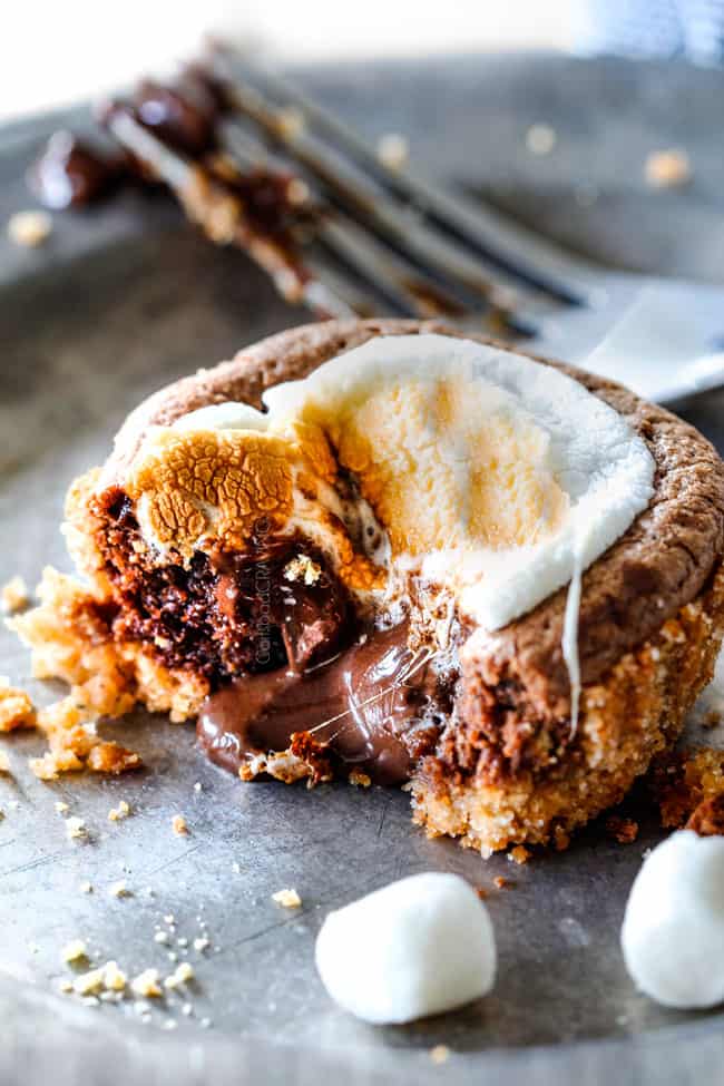 EASY - 30 Minute - S'mores Molten Lava Pies are decadently rich, with an oozing chocolate center, topped with melty toasted marshmallows all nestled in a buttery graham cracker crust - BUT - they are super easy to make and baked in a muffin tin so no special equipment is required!