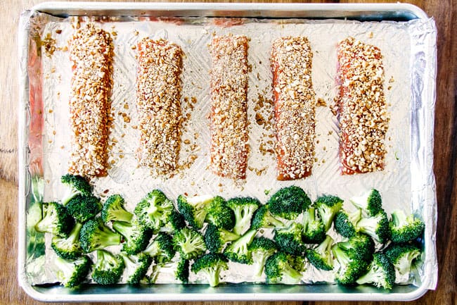 Honey Soy Salmon on a baking sheet with broccoli ready to go in the oven