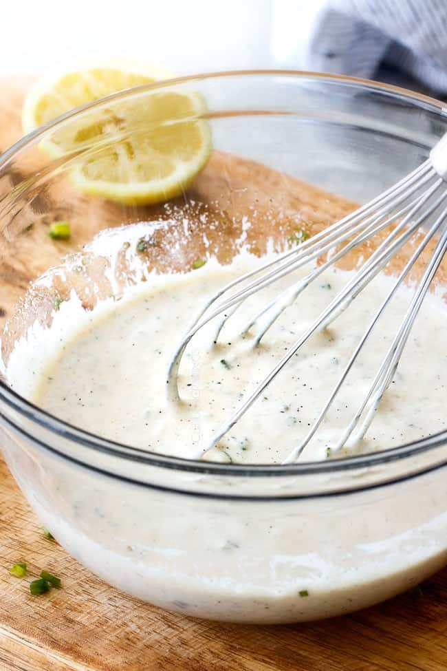 Showing how to make Lemon Chive Dressing for best BLT Pasta Salad by whisking together dressing ingredients in a glass bowl until smooth and creamy