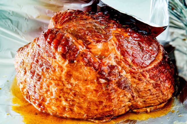 Showing How to Cook a Precooked Ham by covering it tightly with foil