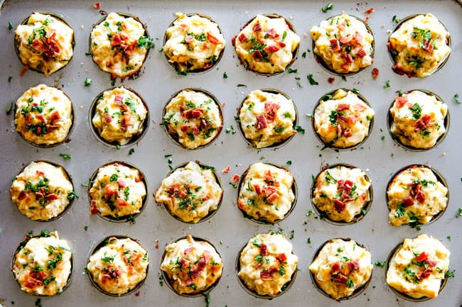 Baked Artichoke Dip Bites garnished with bacon and parsley