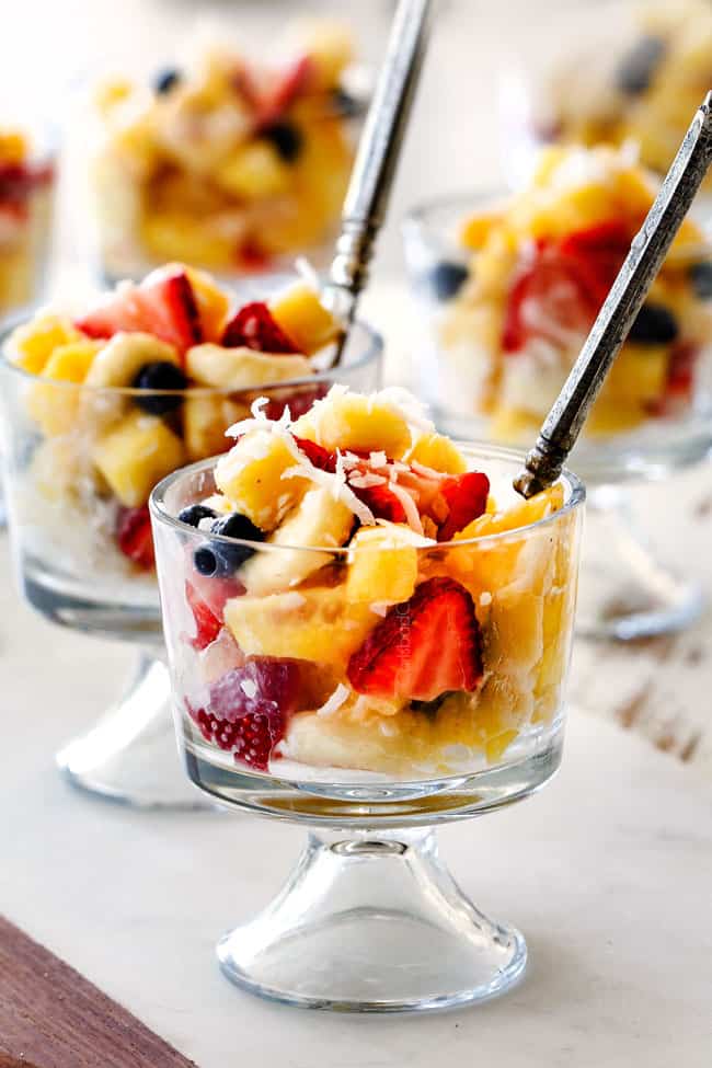 best easy Pina Colada Fruit Salad in a glass with a spoon