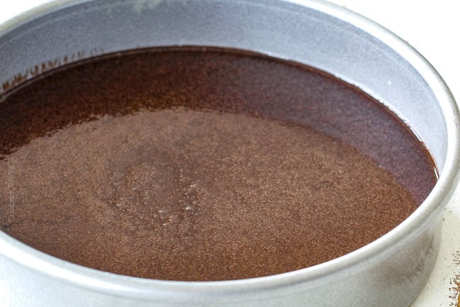 pouring moist chocolate raspberry cake batter into cake pan