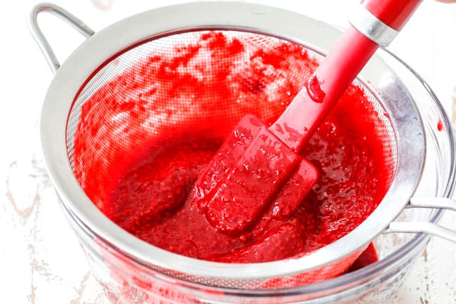 showing how to make homemade raspberry jam by adding raspberry puree to sieve and straining out seeds for Chocolate Cake with Raspberry Filling