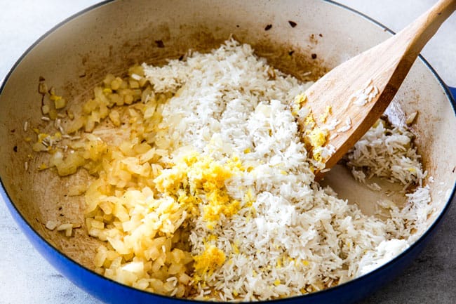 Showing how to prepare Lemon Rice by sauteing rice with garlic and lemon zest. 