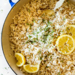 Showing how to make Lemon Rice in rice cooker by adding all ingredients to rice cooker